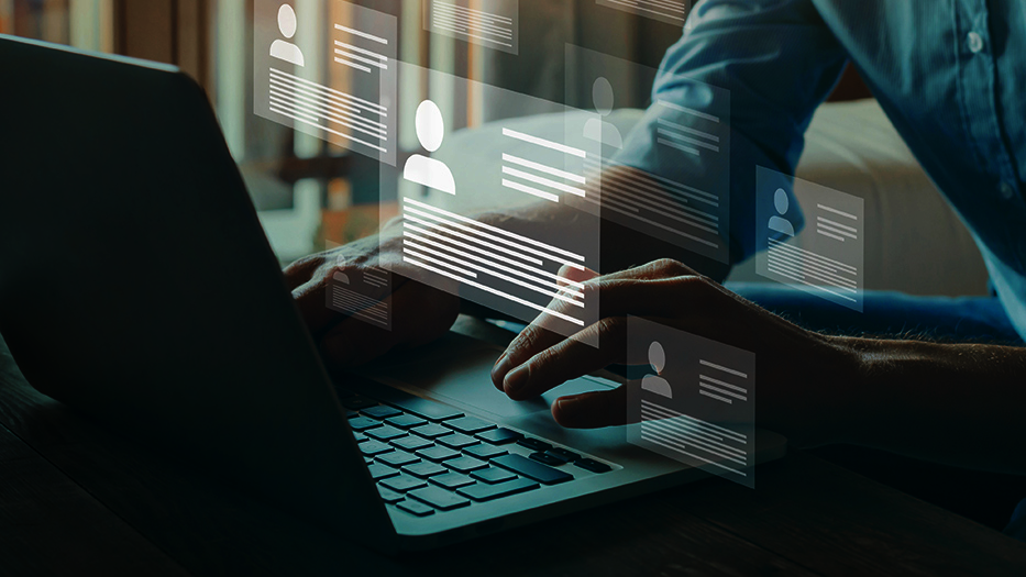 Man in front of a laptop are displayed different identities